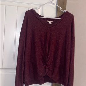 red knotted sweater